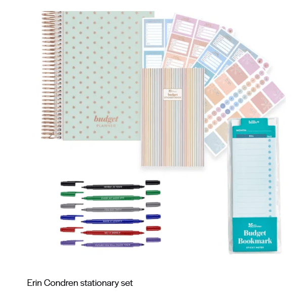 Pastel budget planner kit with stickers, pens, and a budgeting notepad.